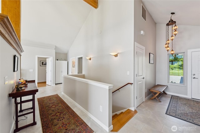 2364 Strawberry Point Rd, Oak Harbor, WA 98277 - entrance foyer with high vaulted ceiling, light tile patterned floors, and baseboards