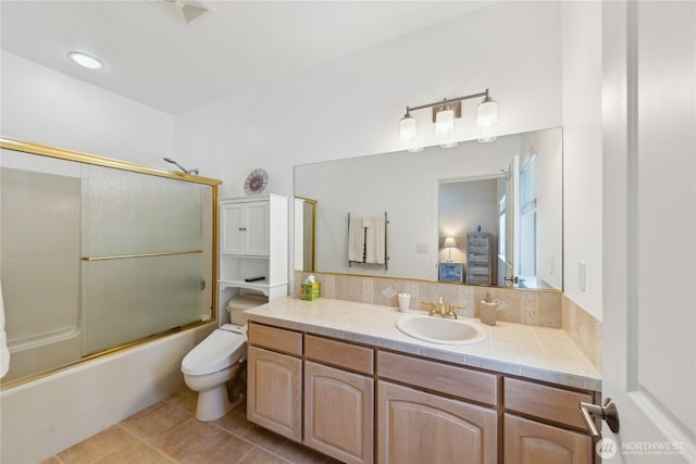 2364 Strawberry Point Rd, Oak Harbor, WA 98277 - bathroom featuring vanity, toilet, bath / shower combo with glass door, and tile patterned floors