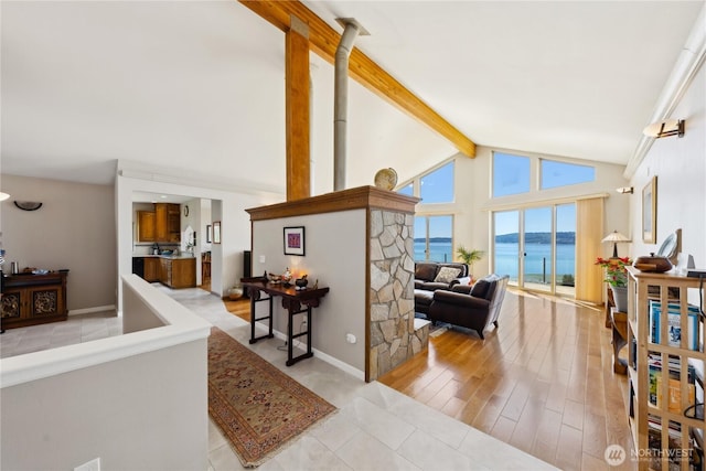 2364 Strawberry Point Rd, Oak Harbor, WA 98277 - living area with a water view, beamed ceiling, and high vaulted ceiling