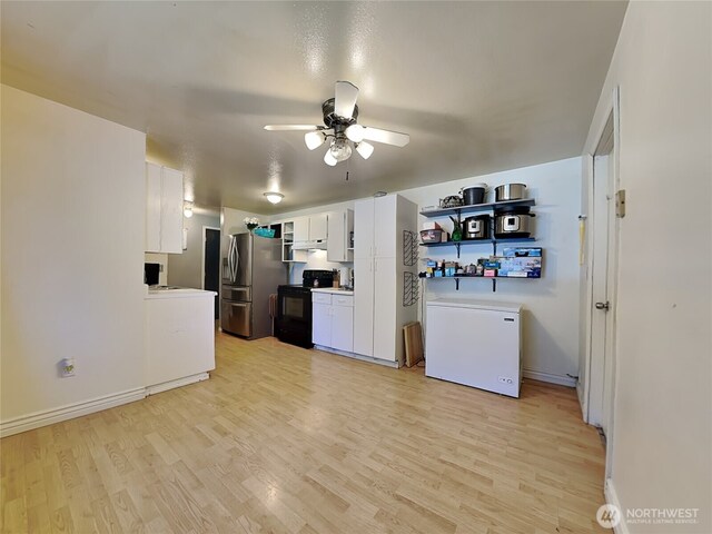 17103 15th Ave E, Spanaway, WA 98387 - kitchen featuring stainless steel refrigerator with ice dispenser, black range with electric stovetop, fridge, and light wood-type flooring