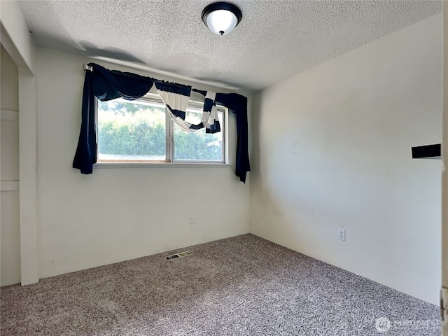 17103 15th Ave E, Spanaway, WA 98387 - carpeted empty room with a textured ceiling