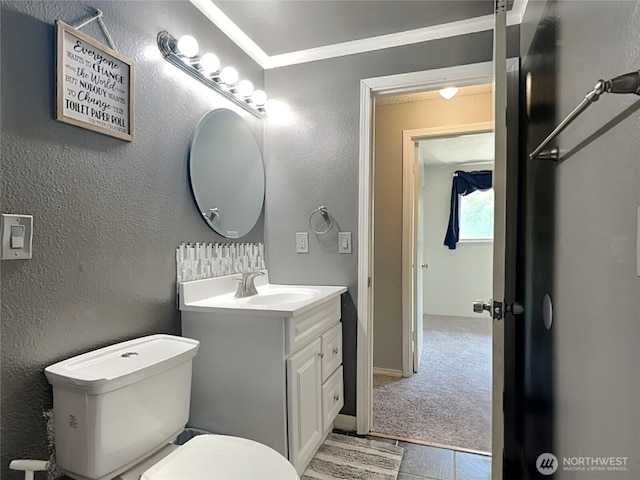 17103 15th Ave E, Spanaway, WA 98387 - bathroom with vanity, toilet, crown molding, and a textured wall