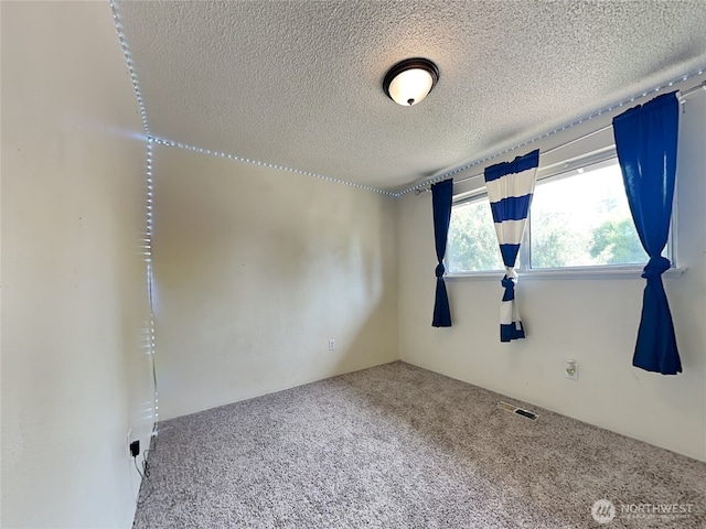 17103 15th Ave E, Spanaway, WA 98387 - spare room with carpet flooring and a textured ceiling