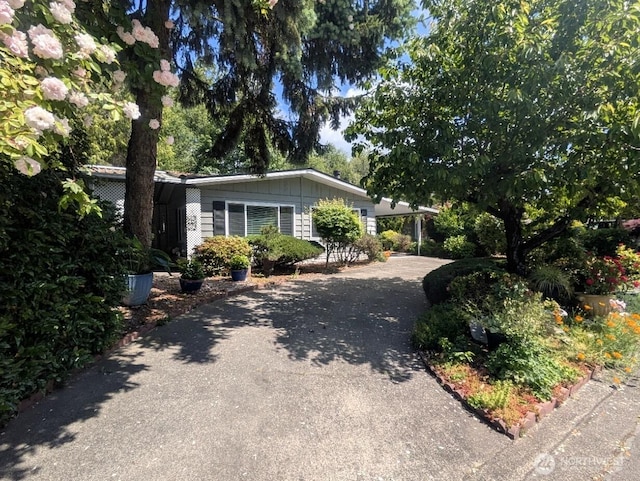 201 Union Ave SE Unit 188, Renton, WA 98059 - view of front of property featuring driveway, board and batten siding, and a carport