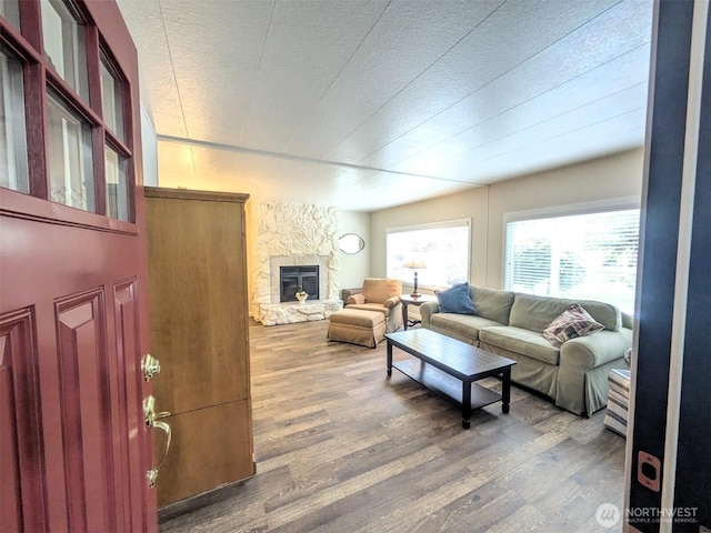 201 Union Ave SE Unit 188, Renton, WA 98059 - living room featuring wood finished floors, a fireplace, and a textured ceiling