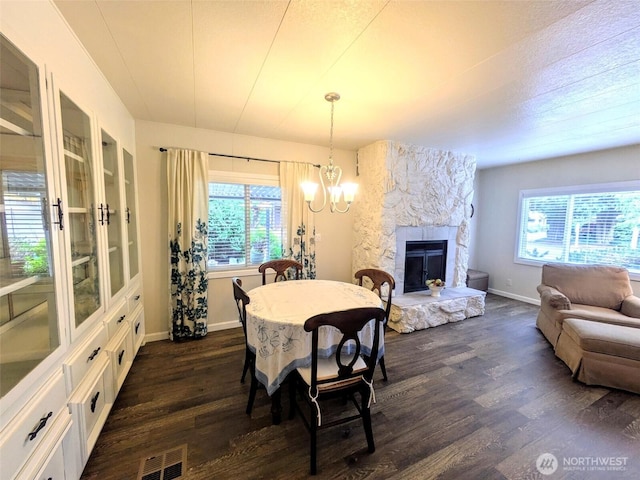 201 Union Ave SE Unit 188, Renton, WA 98059 - dining room featuring dark wood-style flooring, a chandelier, baseboards, and healthy amount of natural light