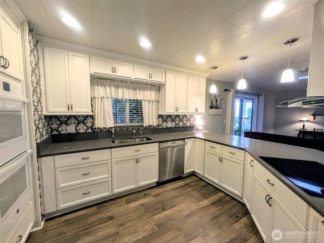 201 Union Ave SE Unit 188, Renton, WA 98059 - kitchen with stainless steel dishwasher, a sink, dark wood finished floors, dark countertops, and recessed lighting