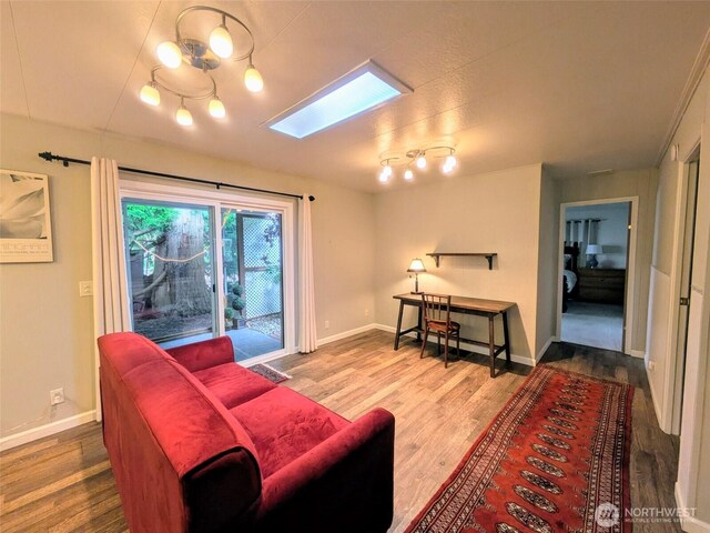 201 Union Ave SE Unit 188, Renton, WA 98059 - living room with wood finished floors, baseboards, and a skylight