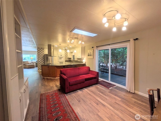 201 Union Ave SE Unit 188, Renton, WA 98059 - living area featuring dark wood finished floors, plenty of natural light, and baseboards