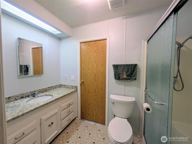 201 Union Ave SE Unit 188, Renton, WA 98059 - bathroom featuring vanity, a shower with door, toilet, and tile patterned floors