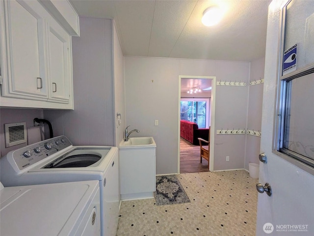 201 Union Ave SE Unit 188, Renton, WA 98059 - washroom with tile patterned floors, washing machine and clothes dryer, and cabinet space