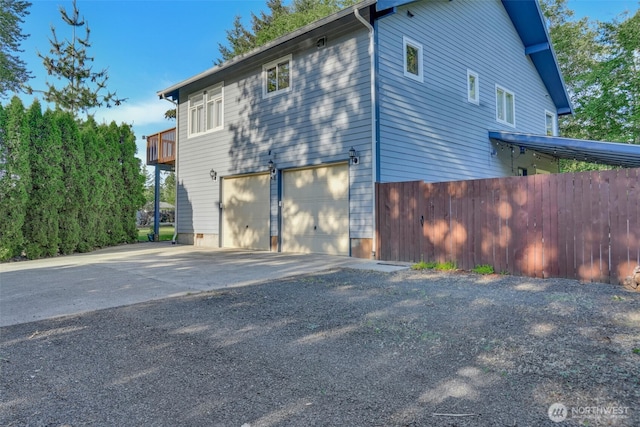 521 E Enchantment Dr, Union, WA 98592 - view of home's exterior with a garage and concrete driveway