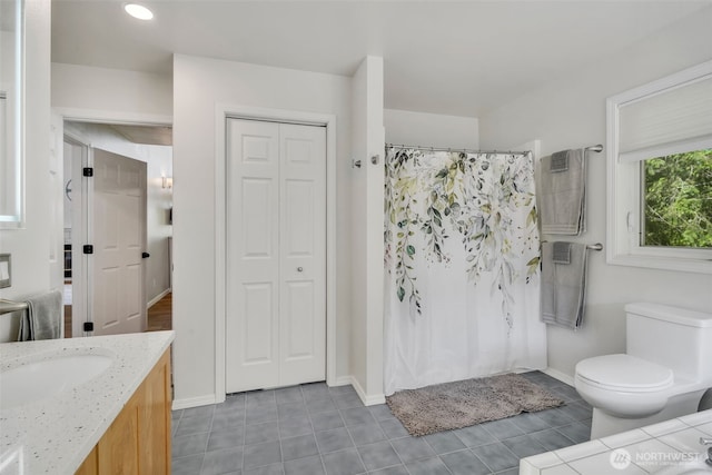 521 E Enchantment Dr, Union, WA 98592 - bathroom featuring vanity, tile patterned floors, toilet, baseboards, and recessed lighting