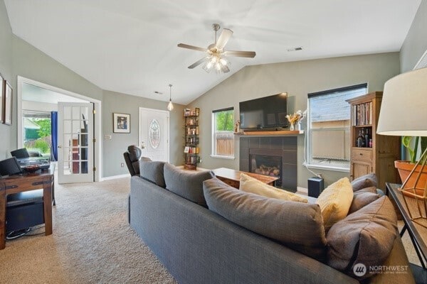 252 NW Ruby Ln, College Place, WA 99324 - living room featuring carpet floors, lofted ceiling, ceiling fan, a fireplace, and baseboards