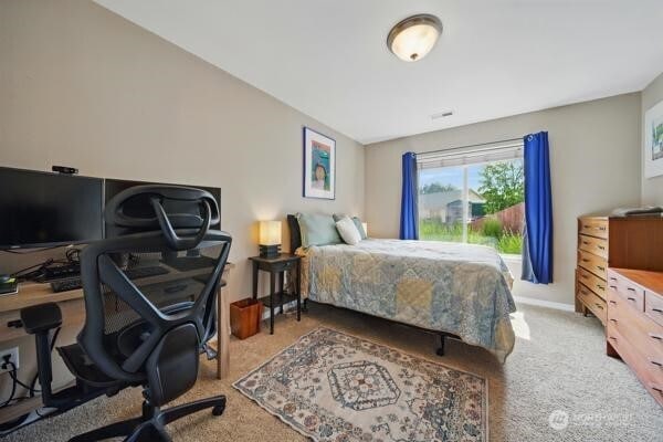 252 NW Ruby Ln, College Place, WA 99324 - bedroom featuring carpet floors, an office area, and baseboards