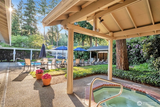 9009 Avondale Rd NE Unit D107, Redmond, WA 98052 - view of patio with a community hot tub and a gazebo