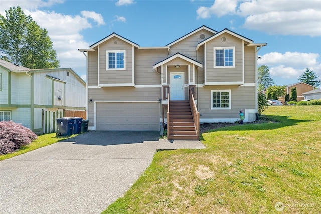 324 E 48th Street Dr, Tacoma, WA 98404 - raised ranch with a garage, driveway, and a front yard