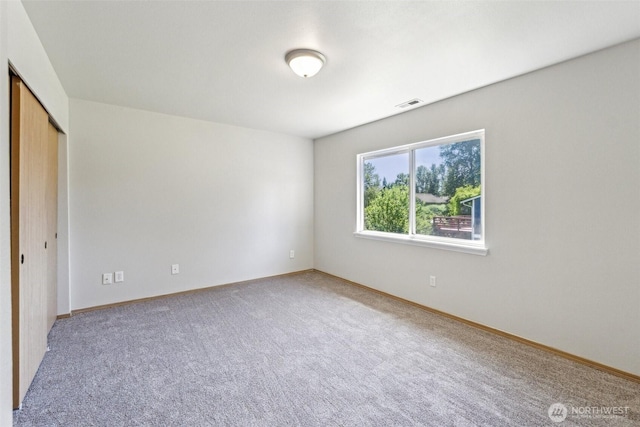 324 E 48th Street Dr, Tacoma, WA 98404 - unfurnished bedroom with carpet flooring, baseboards, and a closet