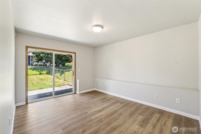 324 E 48th Street Dr, Tacoma, WA 98404 - spare room with wood finished floors and baseboards