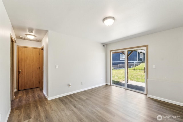 324 E 48th Street Dr, Tacoma, WA 98404 - spare room featuring wood finished floors and baseboards
