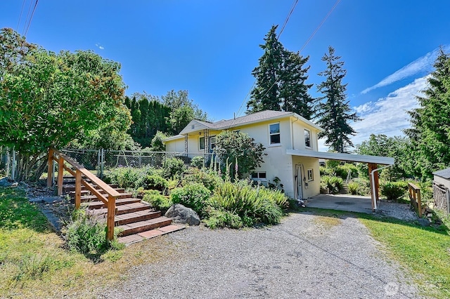 1160 St Paul St, Bellingham, WA 98229 - view of front facade with concrete driveway, stucco siding, and a carport