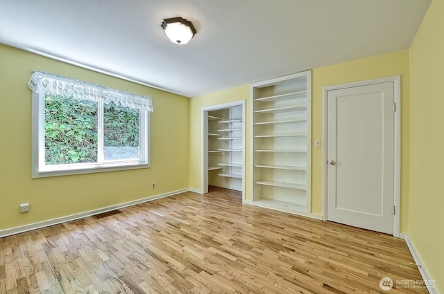 1160 St Paul St, Bellingham, WA 98229 - unfurnished bedroom featuring wood finished floors and baseboards