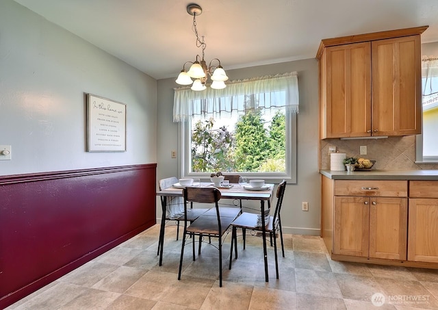 1160 St Paul St, Bellingham, WA 98229 - dining space featuring a chandelier and baseboards