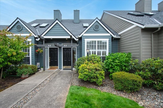 9008 NE 54th St Unit A3, Vancouver, WA 98662 - doorway to property featuring a chimney and roof with shingles