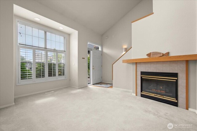 9008 NE 54th St Unit A3, Vancouver, WA 98662 - unfurnished living room featuring carpet flooring, a tile fireplace, and recessed lighting