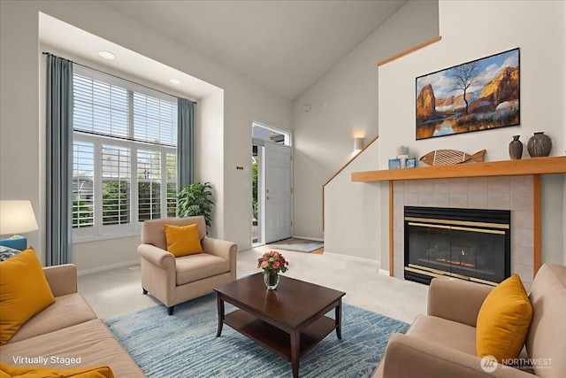 9008 NE 54th St Unit A3, Vancouver, WA 98662 - carpeted living area featuring a tile fireplace, vaulted ceiling, and recessed lighting