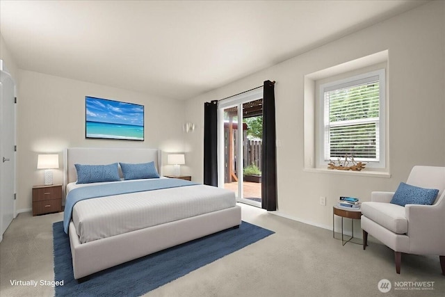 9008 NE 54th St Unit A3, Vancouver, WA 98662 - carpeted bedroom featuring access to exterior and baseboards