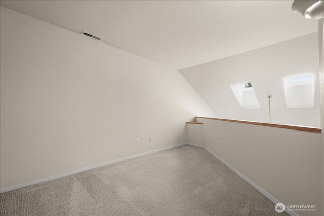 9008 NE 54th St Unit A3, Vancouver, WA 98662 - spacious closet featuring a skylight, carpet flooring, and vaulted ceiling