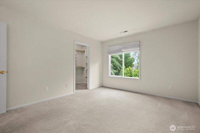 9008 NE 54th St Unit A3, Vancouver, WA 98662 - unfurnished bedroom featuring carpet floors, a walk in closet, and a closet