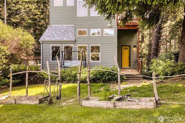 24 Nancy Ln, Copalis Beach, WA 98535 - back of house with a lawn and a shingled roof