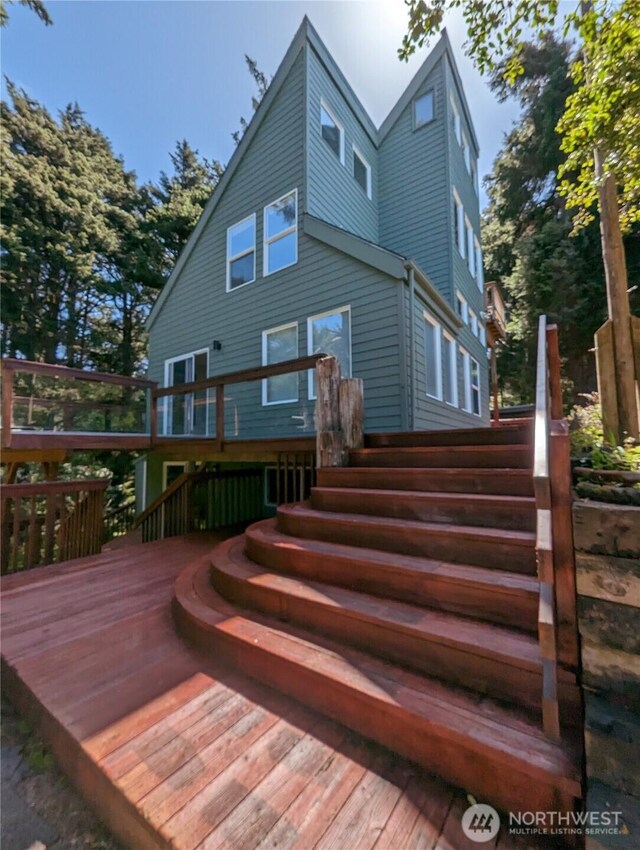 24 Nancy Ln, Copalis Beach, WA 98535 - rear view of house with a wooden deck