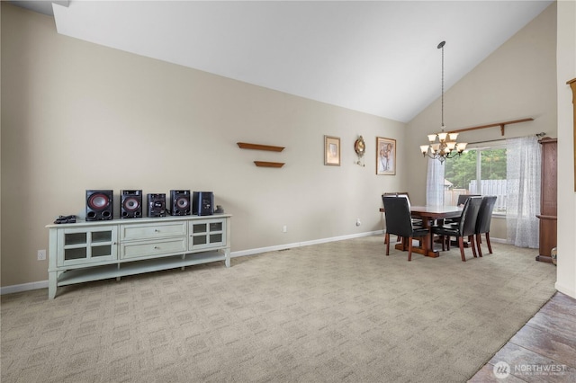 972 Rose Pl, Buckley, WA 98321 - carpeted dining space featuring a chandelier, high vaulted ceiling, and baseboards