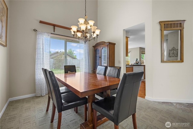 972 Rose Pl, Buckley, WA 98321 - dining room with a chandelier, healthy amount of natural light, carpet flooring, baseboards, and a high ceiling