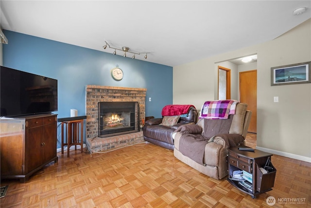 972 Rose Pl, Buckley, WA 98321 - living area with a fireplace and baseboards