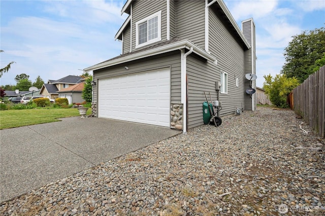 972 Rose Pl, Buckley, WA 98321 - view of side of property featuring asphalt driveway, a chimney, and an attached garage
