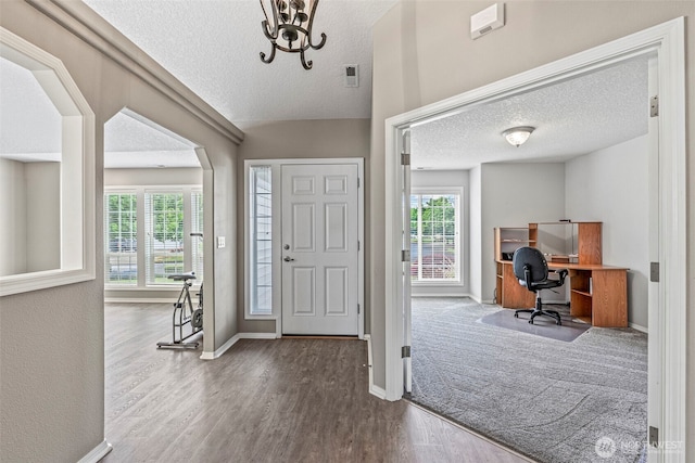 2321 52nd Ave, Longview, WA 98632 - foyer entrance with a textured ceiling, plenty of natural light, wood finished floors, and baseboards