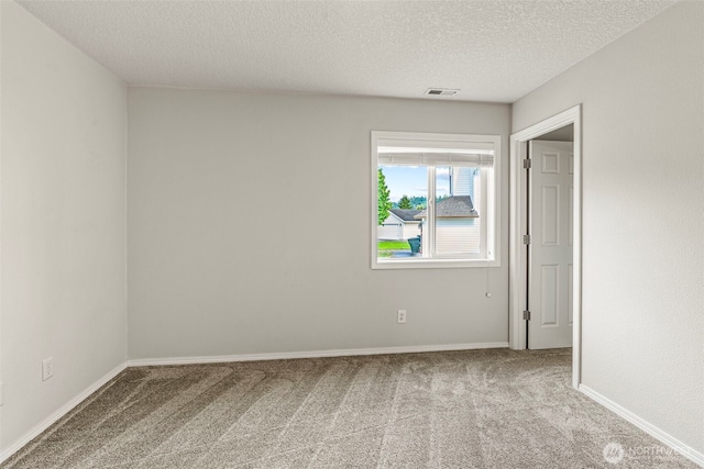2321 52nd Ave, Longview, WA 98632 - carpeted empty room with a textured ceiling and baseboards