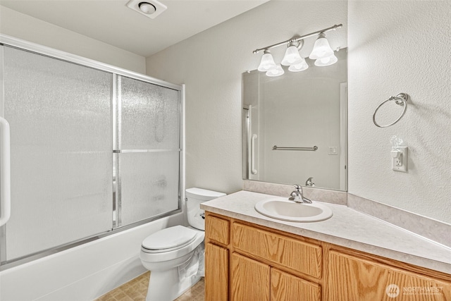 2321 52nd Ave, Longview, WA 98632 - bathroom featuring vanity, toilet, enclosed tub / shower combo, and a textured wall