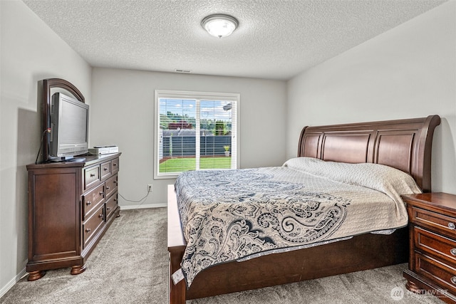 2321 52nd Ave, Longview, WA 98632 - bedroom featuring light carpet, a textured ceiling, and baseboards