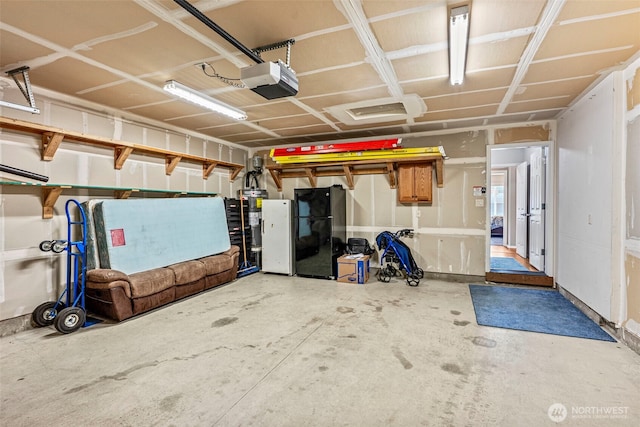 2321 52nd Ave, Longview, WA 98632 - garage featuring freestanding refrigerator and a garage door opener