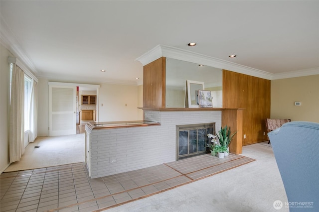 809 N K St, Aberdeen, WA 98520 - unfurnished living room featuring light colored carpet, a fireplace, light tile patterned flooring, crown molding, and recessed lighting