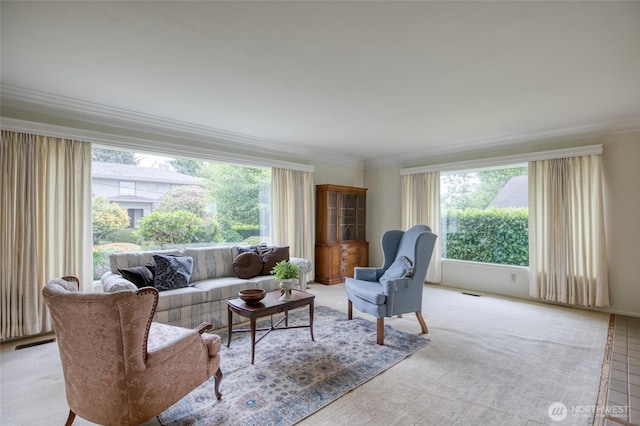 809 N K St, Aberdeen, WA 98520 - living room with plenty of natural light, crown molding, and light carpet