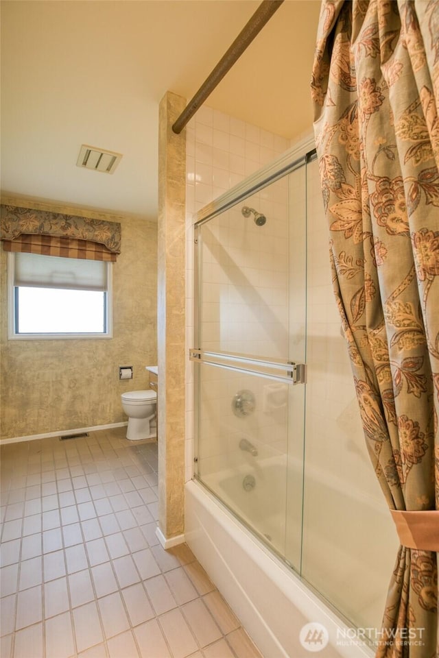 809 N K St, Aberdeen, WA 98520 - bathroom featuring tile patterned floors, bath / shower combo with glass door, and toilet