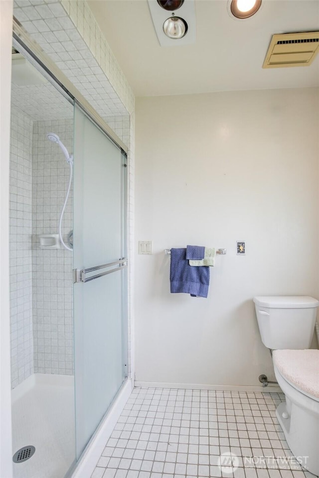 809 N K St, Aberdeen, WA 98520 - full bath with toilet, baseboards, a stall shower, and tile patterned flooring