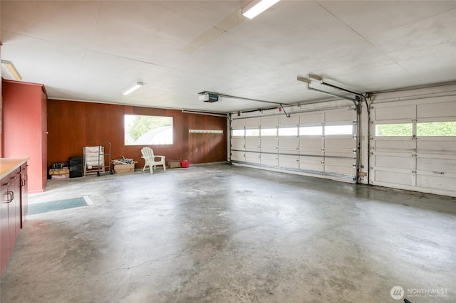 809 N K St, Aberdeen, WA 98520 - garage with a garage door opener and wood walls