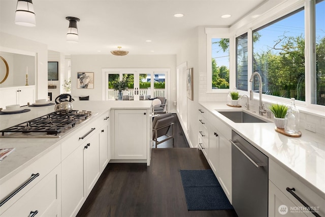 6006 SE 30th St, Mercer Island, WA 98040 - kitchen featuring a sink, appliances with stainless steel finishes, french doors, dark wood-style flooring, and white cabinets